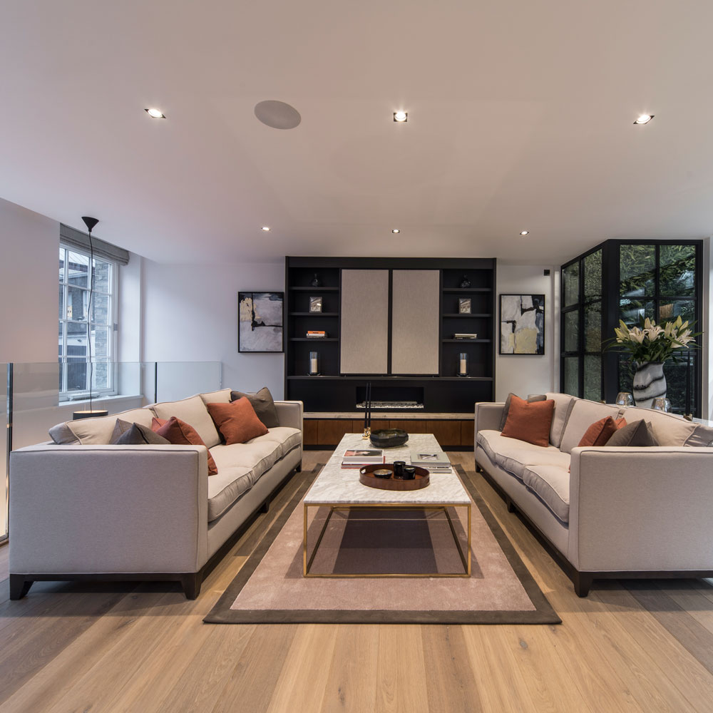ellie goldings house living room with sofa cushions and coffee table