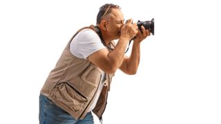 Photographer using camera wearing a photo vest