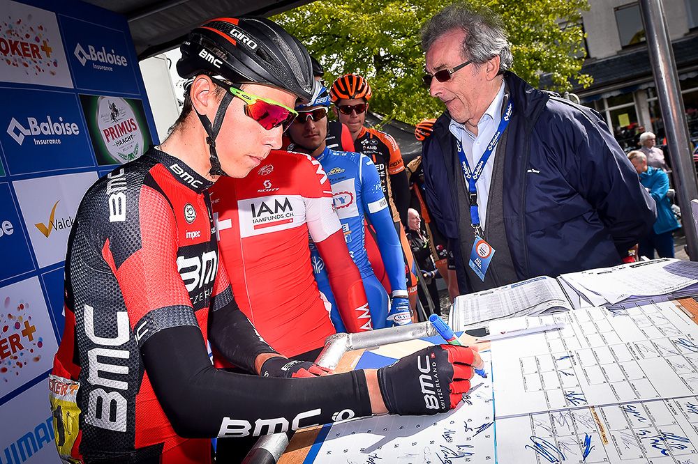 Riders sign in before the final stage in Belgium.