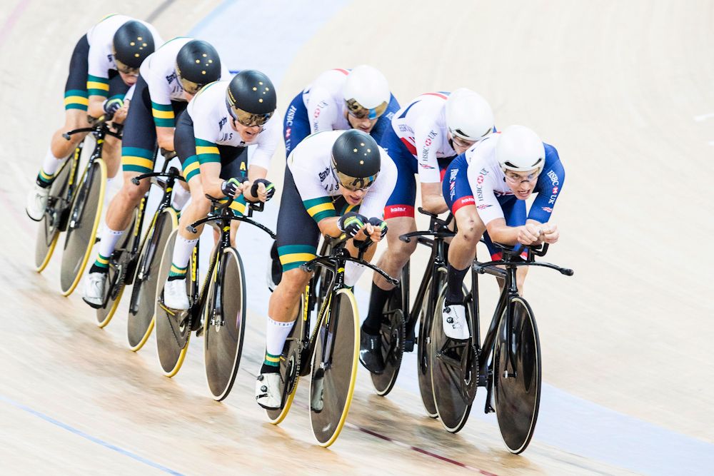 The team of Australia with Nathan Hart, Cameron Meyer, Alexander Porter and Sam Welsford and the team of Great Britain with Steven Burke, Andrew Tennant, Joseph Truman and Oliver Wood compete in the Men's Team Pursuit Qualifying match on Day One
