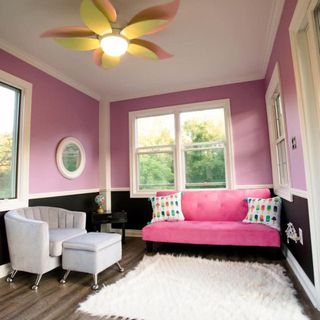 room with pink sofa and mirror