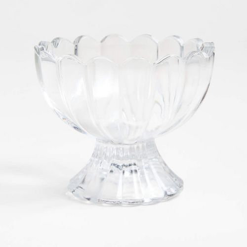 Small scalloped glass dish on a white background