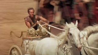 Charlton Heston driving a chariot in Ben-Hur.