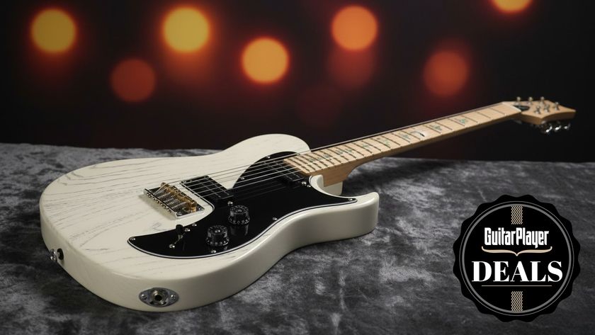 PRS guitar laying on a marble surface