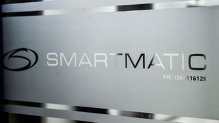 Picture of the logo of Smartmatic seen on a sliding door at the headquarters of the company in Caracas, on Aug. 2, 2017
