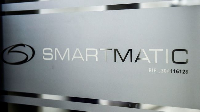 Picture of the logo of Smartmatic seen on a sliding door at the headquarters of the company in Caracas, on Aug. 2, 2017