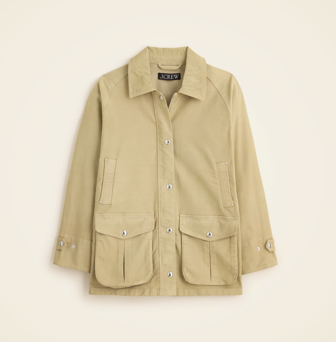 a jcrew barn jacket in front of a plain backdrop