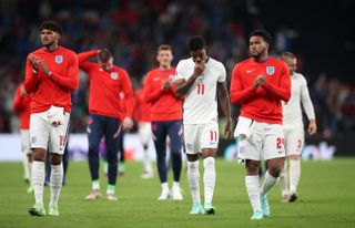 Tyrone Mings (left), Marcus Rashford and Reece James after the Euro 2020 final
