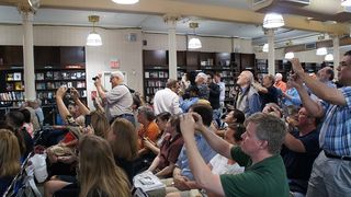 The crowd at Barnes & Noble in Union Square snaps photos of Aldrin, still a space rock star.
