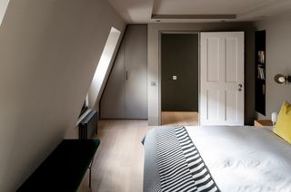 Loft bedroom with olive green walls