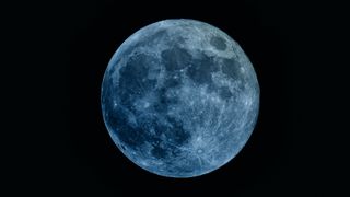 Image of a full moon with a blue hue for artistic effect. The moon doesn't turn blue during a "Blue Moon".