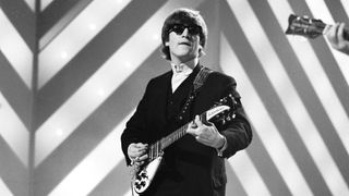 John Lennon (1940-1980) of English rock and pop group The Beatles plays his second Rickenbacker 325 guitar on stage during rehearsals for the ABC Television music television show 'Thank Your Lucky Stars' Summer Spin at Teddington Studios in London on 11th July 1964. The band would go on to play four songs on the show, A Hard Day's Night, Long Tall Sally, Things We Said Today and You Can't Do Tha