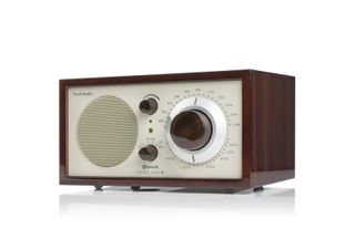 A rectangular dial-driven AM/Fm radio in walnut case and light grey face. Dials are in Walnut shade
