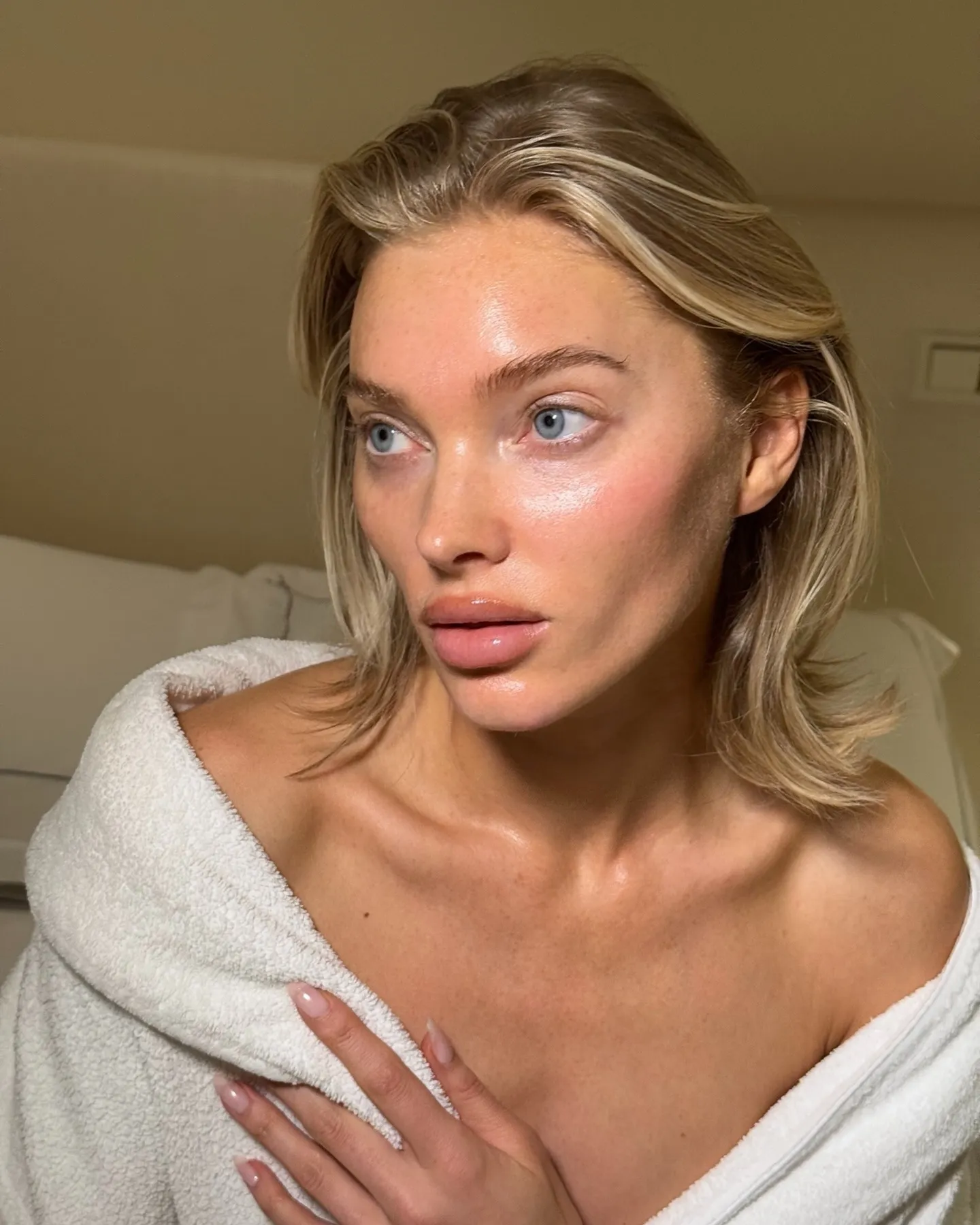 A photo of Elsa Hosk wearing a white dressing gown