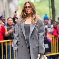 Jennifer Lopez in grey furry coat.