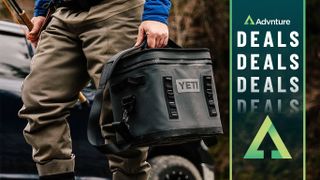 Man carrying Yeti Flip cooler