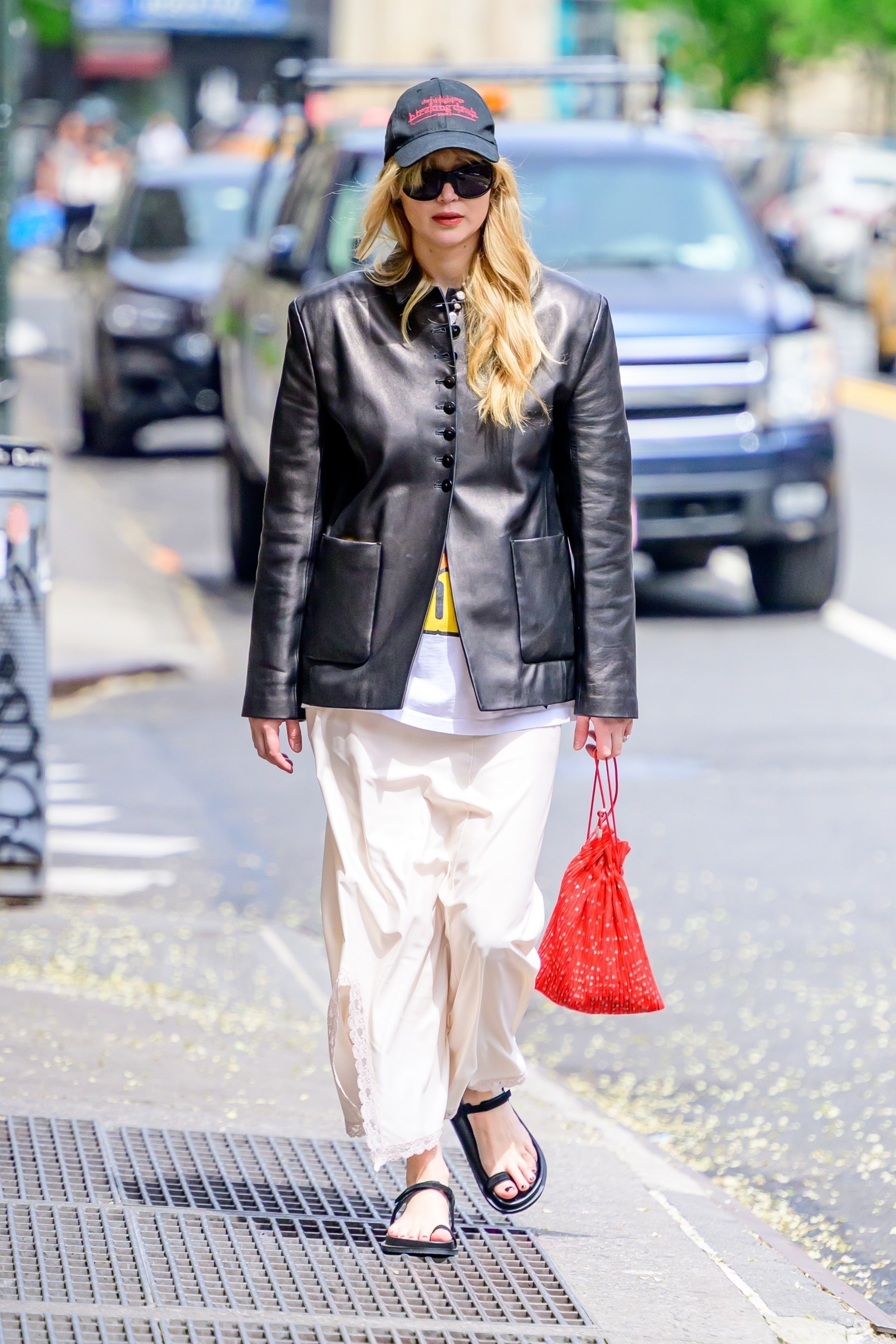 Jennifer Lawrence is spotted out and about in New York City, capturing attention with her presence wearing toe ring sandals