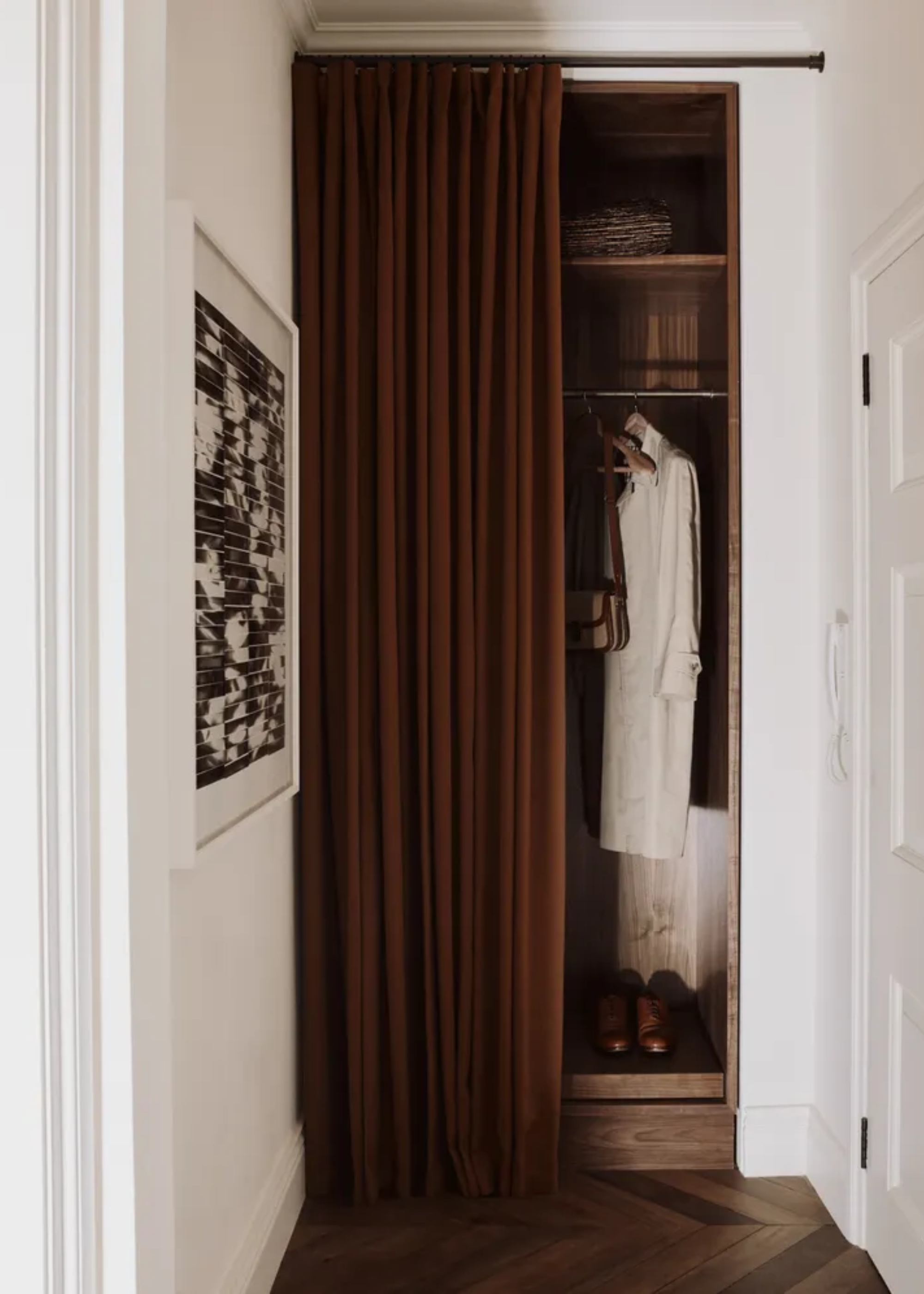 A closet with a chocolate brown curtain