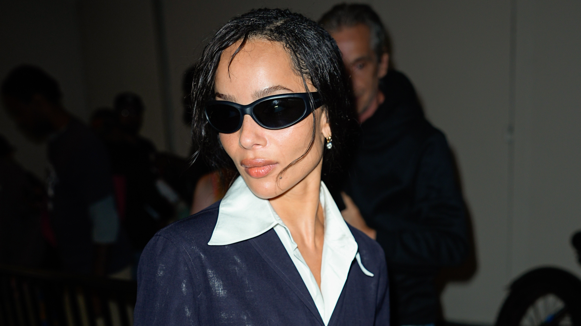 Zoë Kravitz was spotted in NYC wearing a denim chambray blue suit set and flip-flops