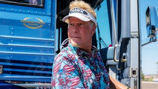 Will Ferrell as Lonnie smirking in The Hawk.