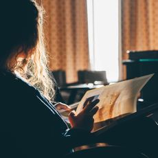 Relaxed woman reading a book