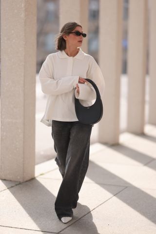 woman wearing polo sweater with pants and heels