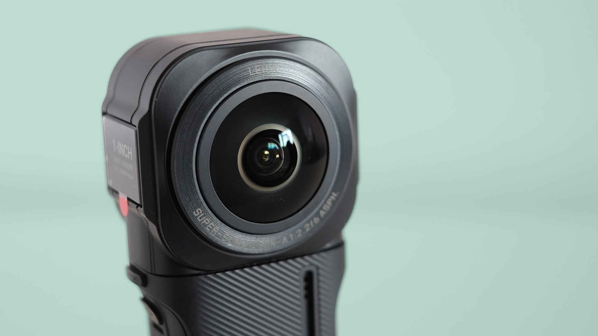 The Insta360 ONE RS 1-Inch 360 Edition camera on a green background