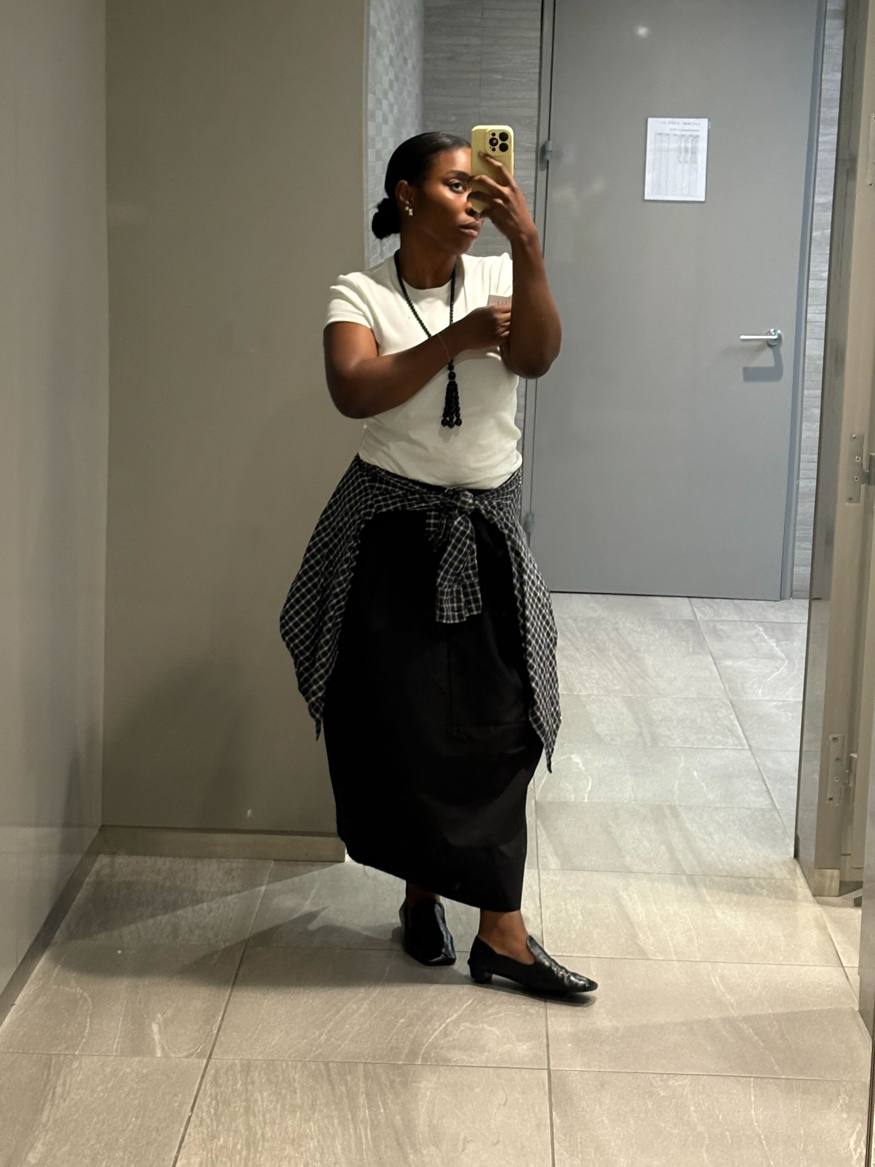 black woman wearing neutral fall outfits