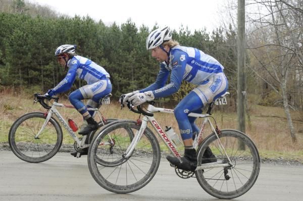 BikeReg-Cannondale teammates Joshua Dillon, left, and Thom Coupe climb Juniper Swamp