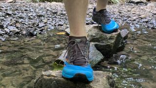 Dynafit Alpine Running Shoes: Alpine Running Shoes on a stream