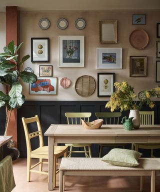 plate and art gallery wall in modern rustic kitchen dining area