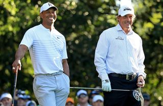 Turner’s Jon Diament hopes a match-play rematch between Tiger Woods (l.) and Phil Mickelson will sate fans who miss live sports. 