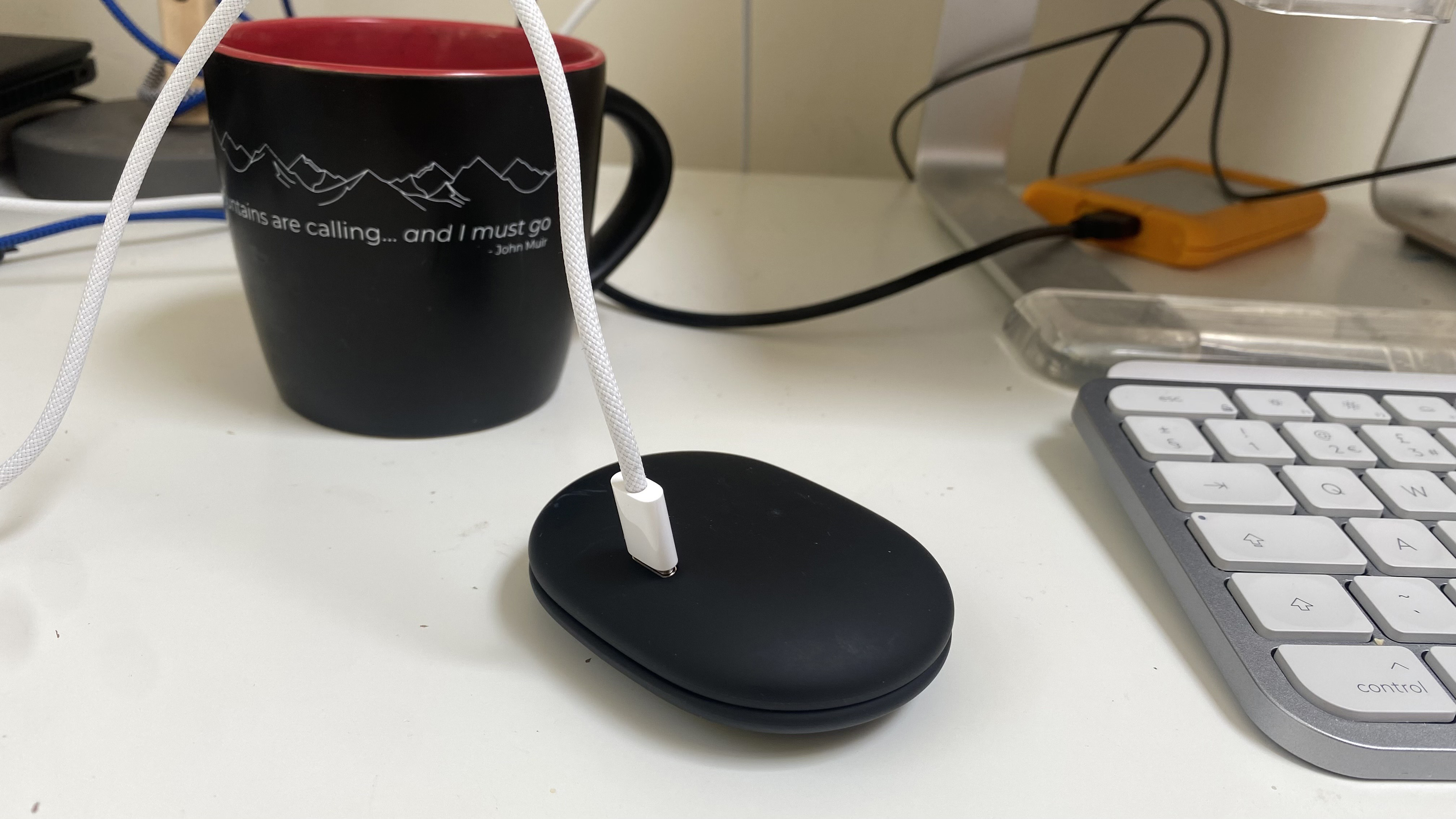 The AceFast AceFit Earbuds on charge