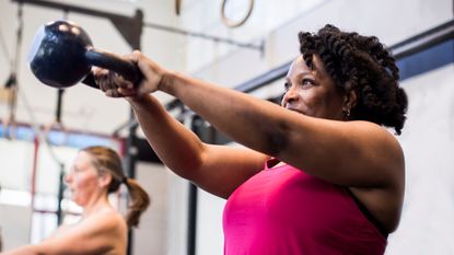 woman doing a kettlebell swing