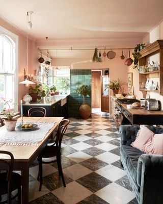 Open plan pink kitchen by deVOL