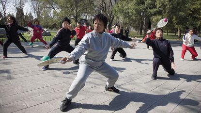 Chinese pensioners doing tai chi