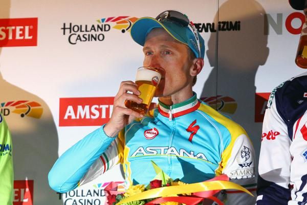 Enrico Gasparotto takes a long pull on his Amstel podium beer