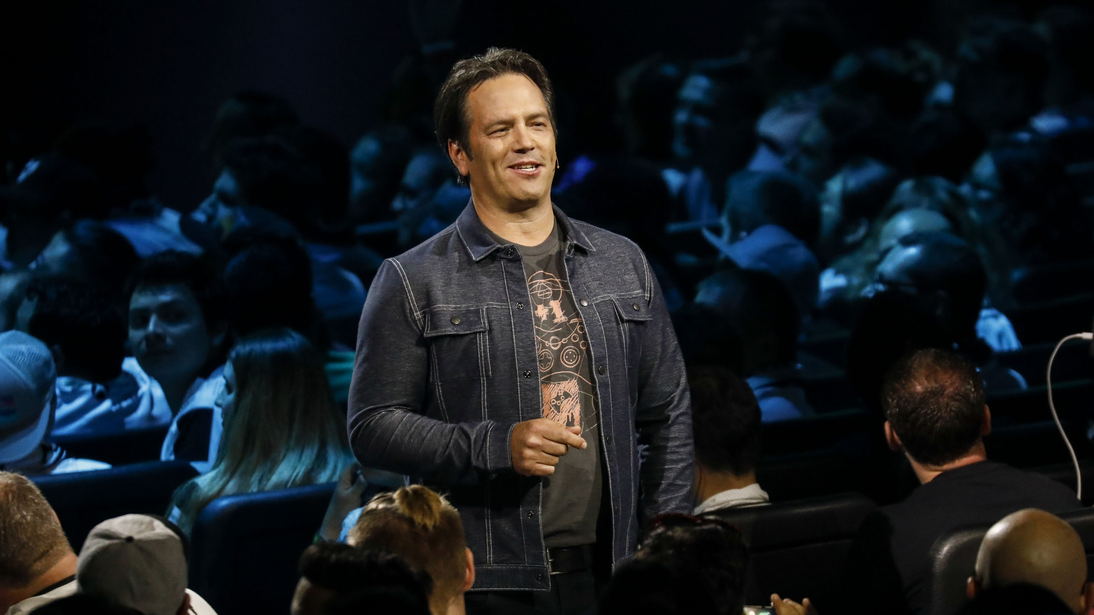Phil Spencer, executive vice president of Gaming for Microsoft Corp., speaks during the company's Xbox event ahead of the E3 Electronic Entertainment Expo in Los Angeles, California, U.S., in Los Angeles, California, U.S., on Sunday, June 10, 2018. Xbox previewed a flurry of new titles and deals with studios as the video-gaming division of&amp;nbsp;Microsoft&amp;nbsp;looks to compete more intensely with&amp;nbsp;Sony Corp.'s PlayStation and a resurgent Nintendo Co. Photographer: Patrick T. Fallon/Bloomberg via Getty Images
