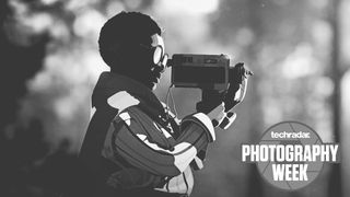A screenshot from Season on PS5 showing a boy holding a camera