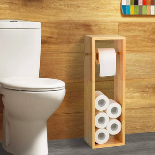 wooden loo roll holder in a wooden bathroom