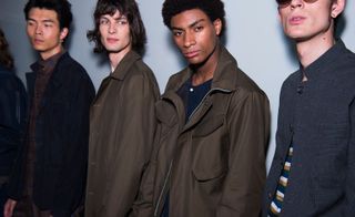 A row of models against a white backdrop