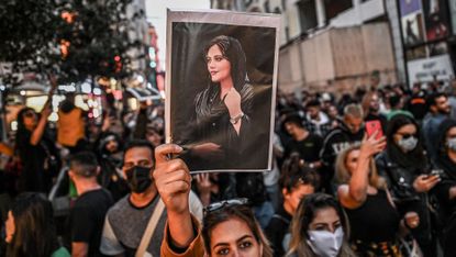 a protest in support of mahsa amini who was killed by the iranian mortality police for not wearing a hijab