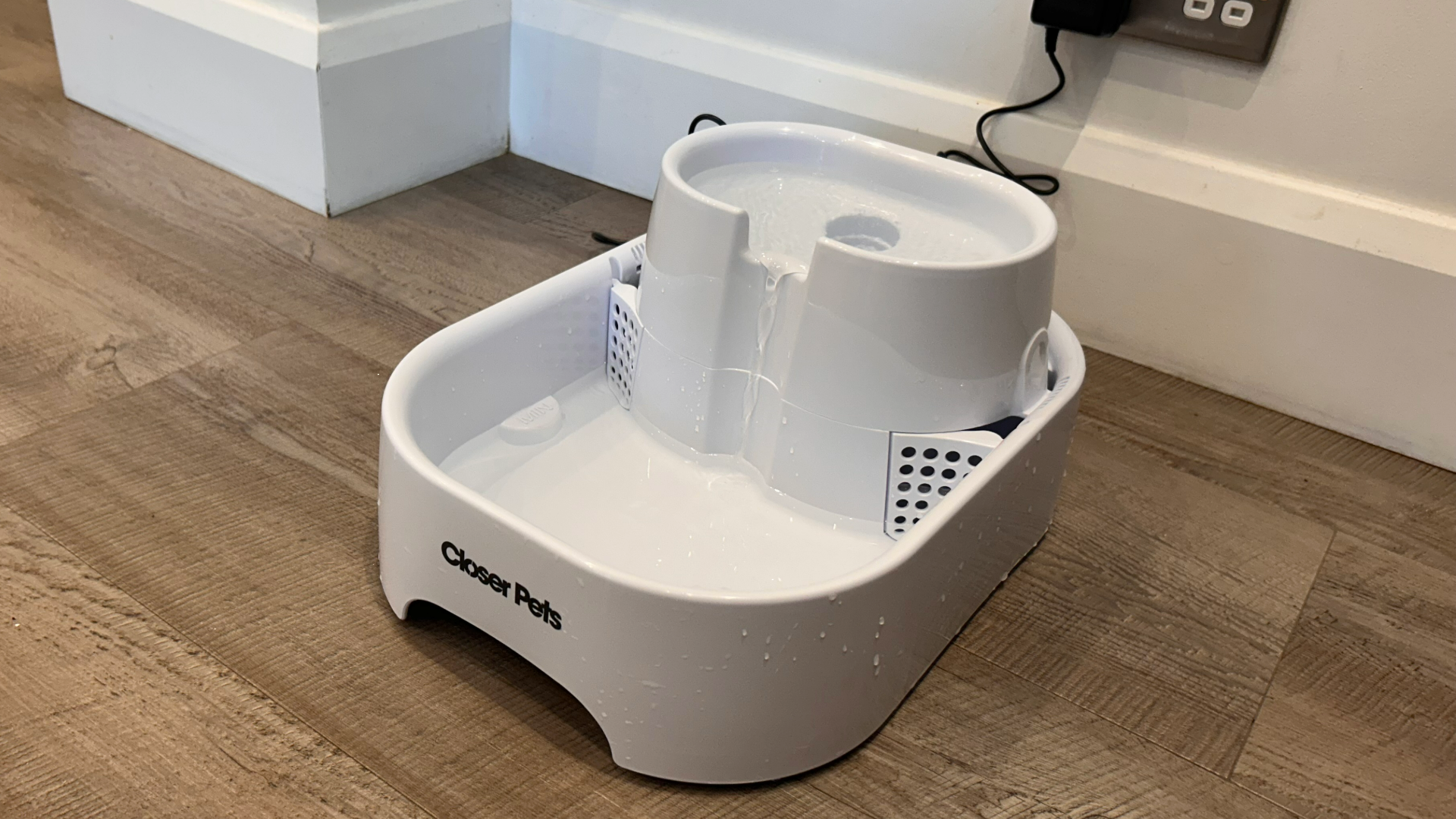 Closer Pets Large White Two-level Pet Fountain, one of the best pet fountains, on grey wooden floor