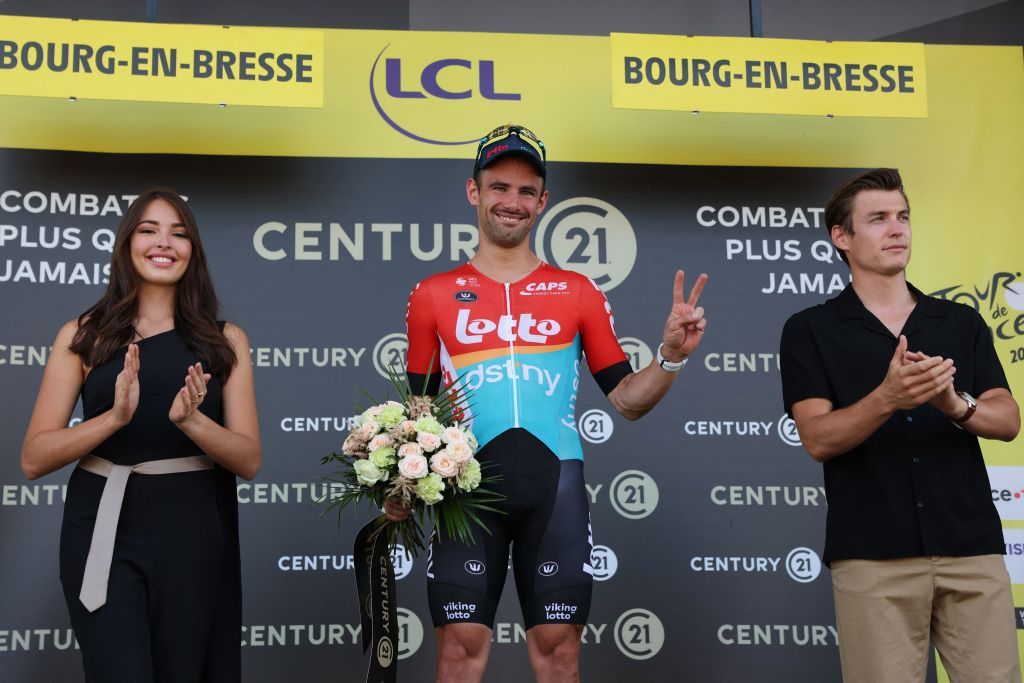 Lotto Dstnys Belgian rider Victor Campenaerts celebrates on the podium with the most combative riders award after the 18th stage of the 110th edition of the Tour de France cycling race 184 km between Moutiers and BourgenBresse in the French Alps on July 20 2023 Photo by Thomas SAMSON AFP Photo by THOMAS SAMSONAFP via Getty Images