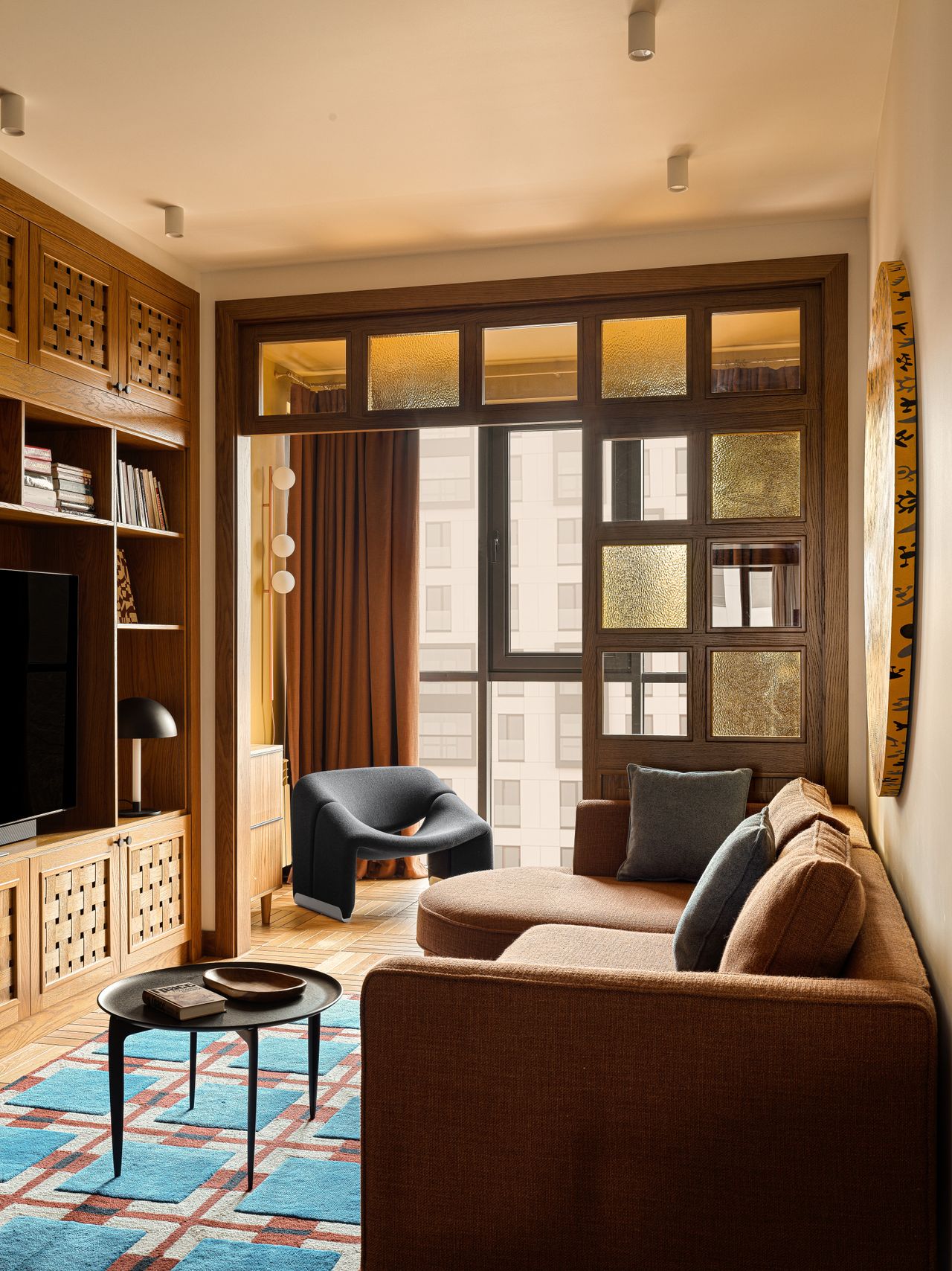 A living room designed in tones of brown, yellow and black