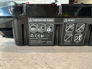 A Specialized E-bike Battery is full of labels and warnings