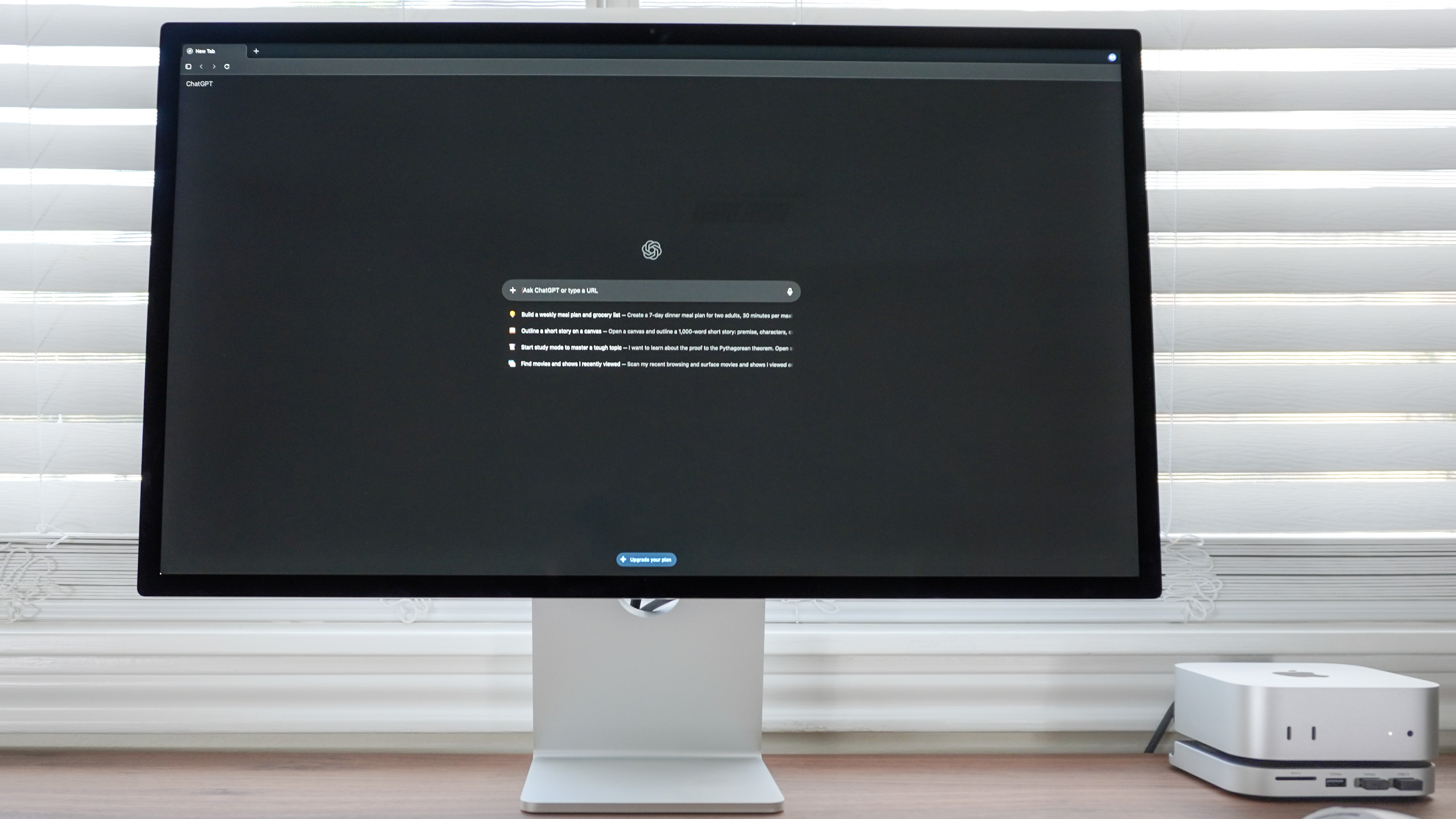 ChatGPT Atlas running on a Mac mini with the browser visible on an Apple Studio Display