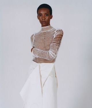 Model wears top and skirt by Louise Korner