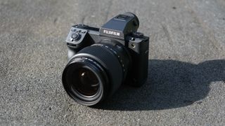 Fujifilm GFX 100 II camera on a dark rough surface