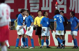 Referee Byron Moreno shows a red card to Francesco Totti during Italy's World Cup last-16 clash against South Korea at the 2002 World Cup.